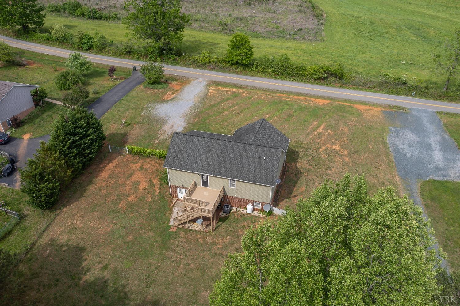 7179 Stage Road Concord, VA 24538 - Photo 47 of 52 an aerial view of a house with a yard and lake view