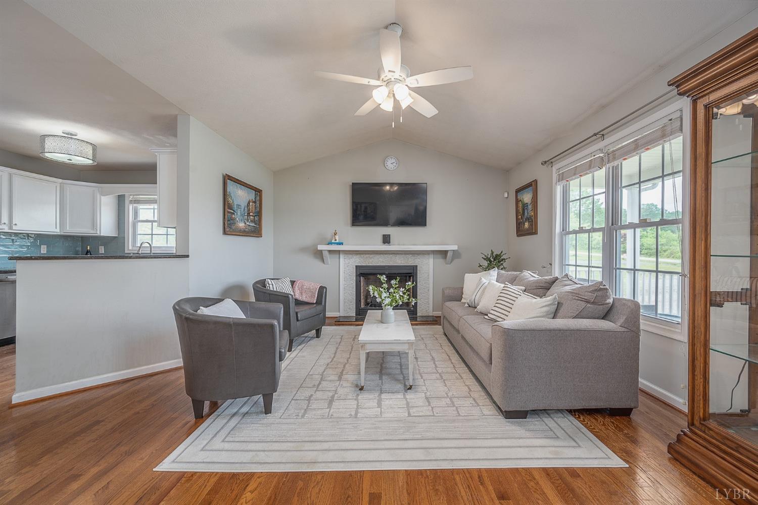 7179 Stage Road Concord, VA 24538 - Photo 5 of 52 a living room with furniture a fireplace and a flat screen tv
