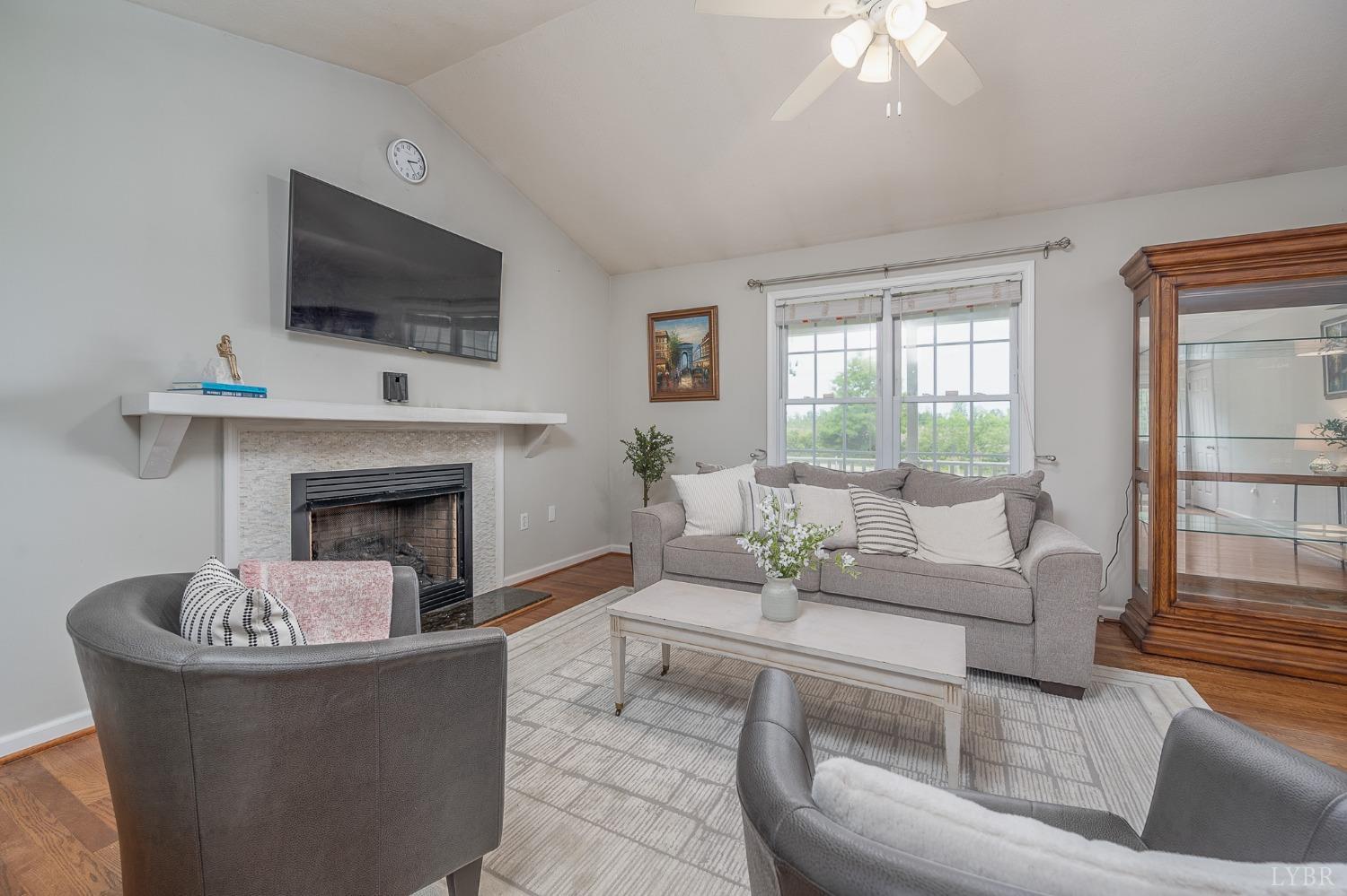 7179 Stage Road Concord, VA 24538 - Photo 6 of 52 a living room with furniture a fireplace and a flat screen tv