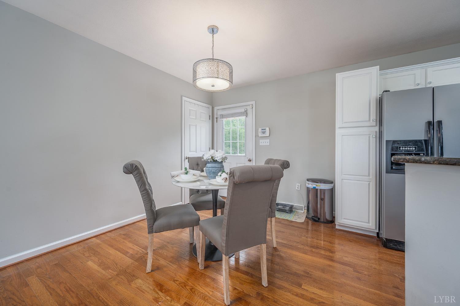 7179 Stage Road Concord, VA 24538 - Photo 8 of 52 a view of a dining room with furniture window and wooden floor