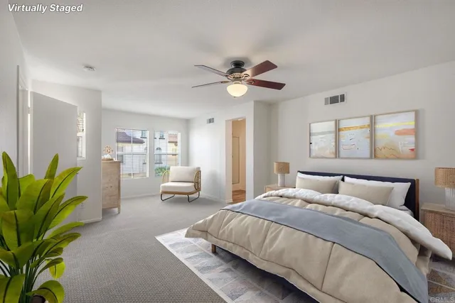 a bedroom with a balcony a bed and a couch