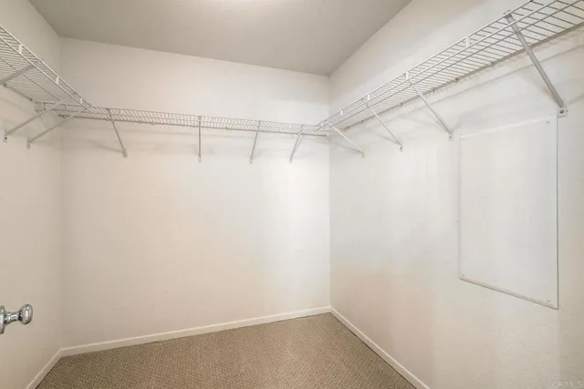 a view of a room with racks on the wall