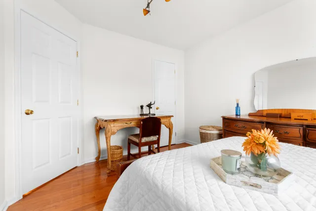 a bedroom with a bed and a table