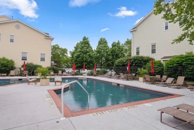 a view of a swimming pool with chairs