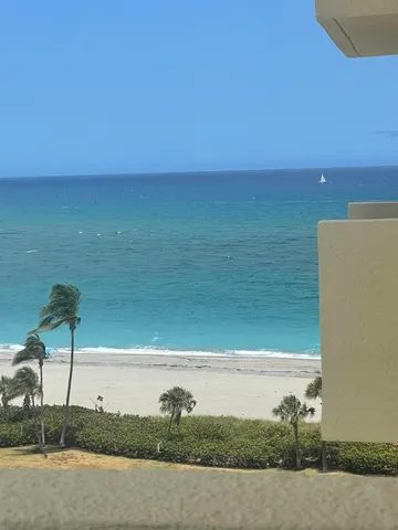 a kitchen with a sink a counter top space stainless steel appliances a window and a counter top space