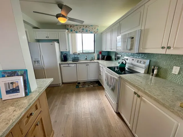a living room with furniture and flowers