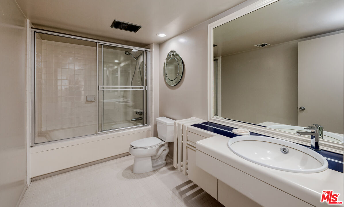 20 Voyage Street Marina del Rey, CA 90292 - Photo 21 of 28 a bathroom with a granite countertop toilet sink and mirror