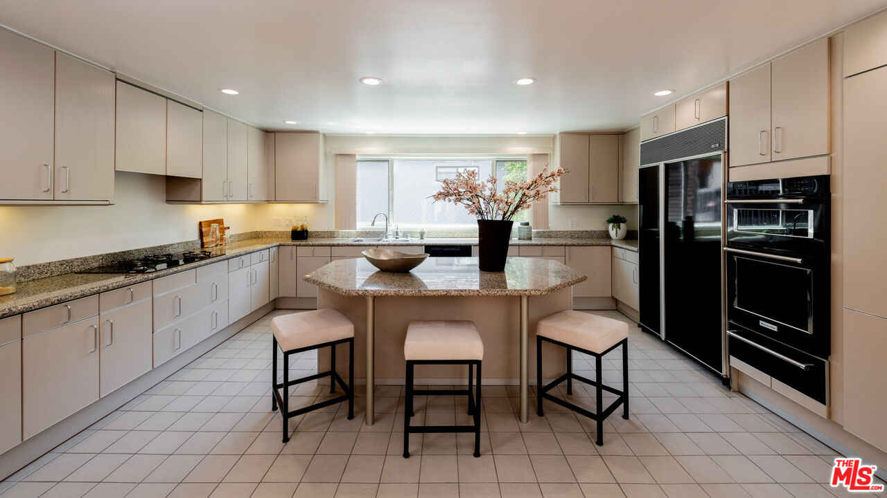 20 Voyage Street Marina del Rey, CA 90292 - Photo 6 of 28 a kitchen with granite countertop cabinets and stainless steel appliances