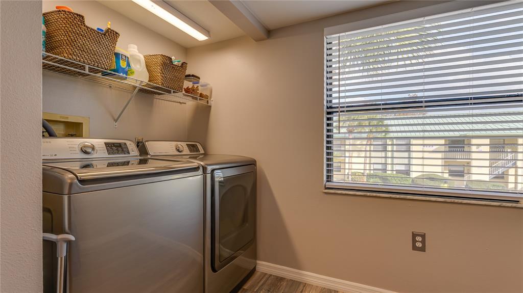 6145 113th Street, Unit 415 Seminole, FL 33772 - Photo 18 of 35 a utility room with dryer and washer