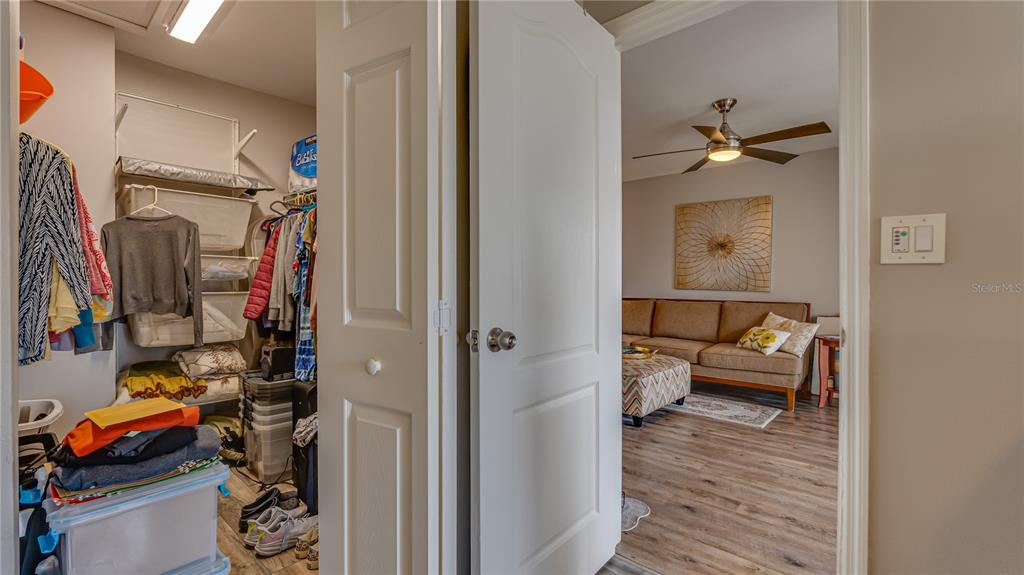 6145 113th Street, Unit 415 Seminole, FL 33772 - Photo 23 of 35 a view of a hallway with workspace and living room
