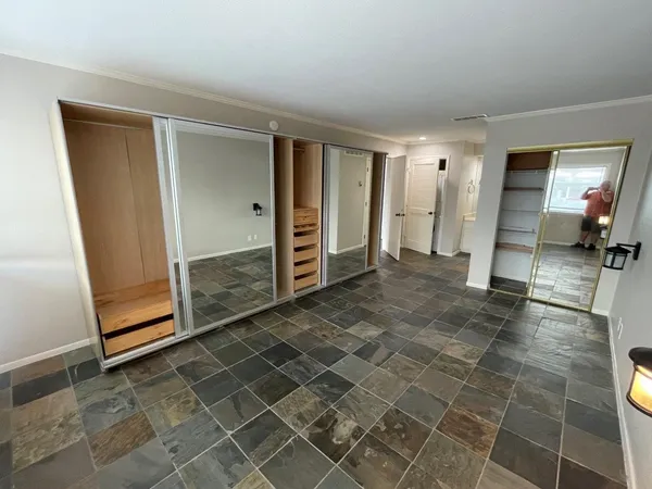 an empty room with a bathroom