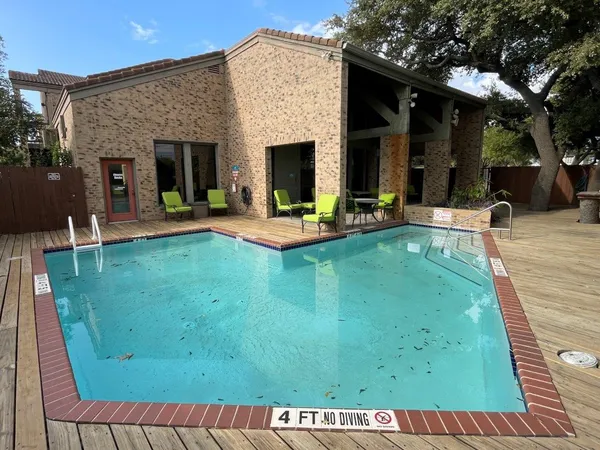 swimming pool view with a outdoor seating