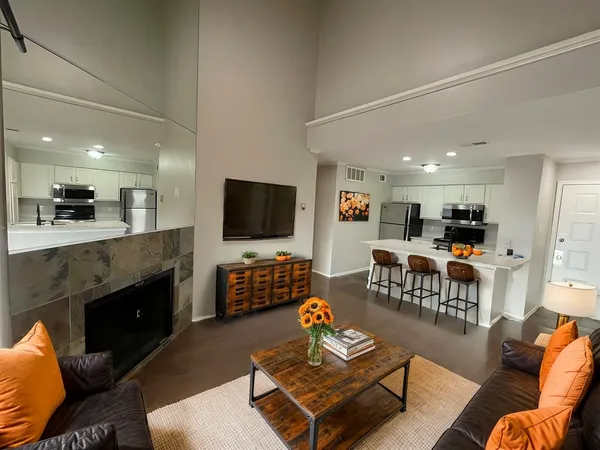 a living room with furniture and a flat screen tv