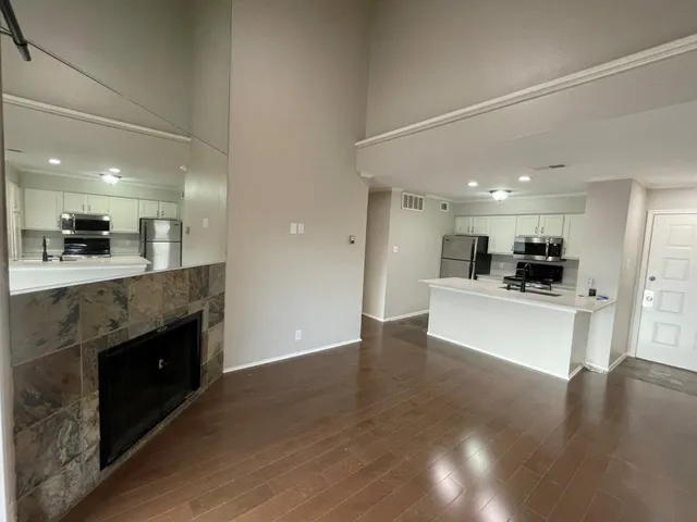 a view of kitchen with refrigerator stove and microwave