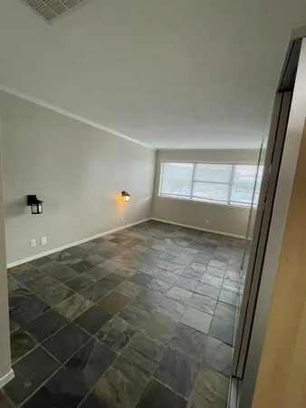 a view of an empty room and window