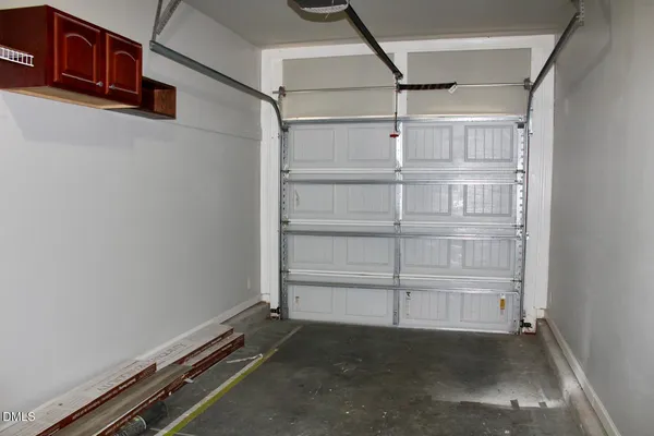 a view of an empty room with racks on the wall