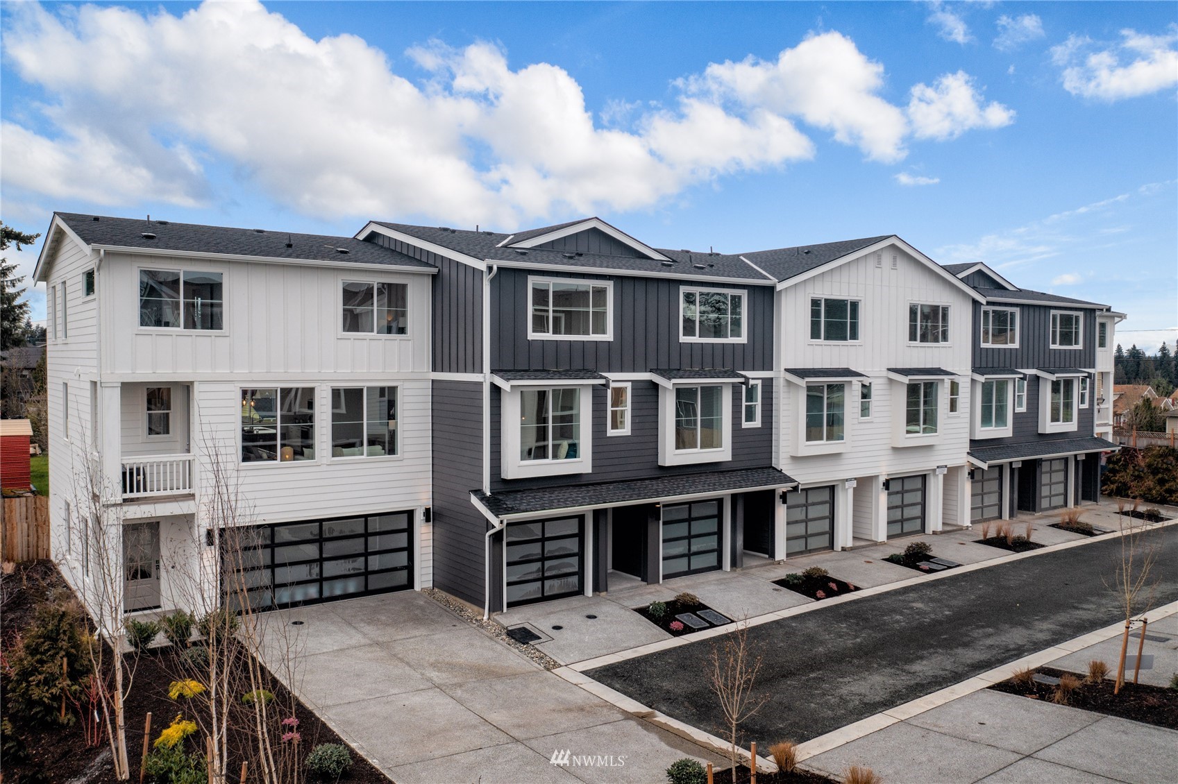 16030 Meadow Road, Unit B7 Lynnwood, WA 98087 - Photo 1 of 1 a front view of a residential houses with city view