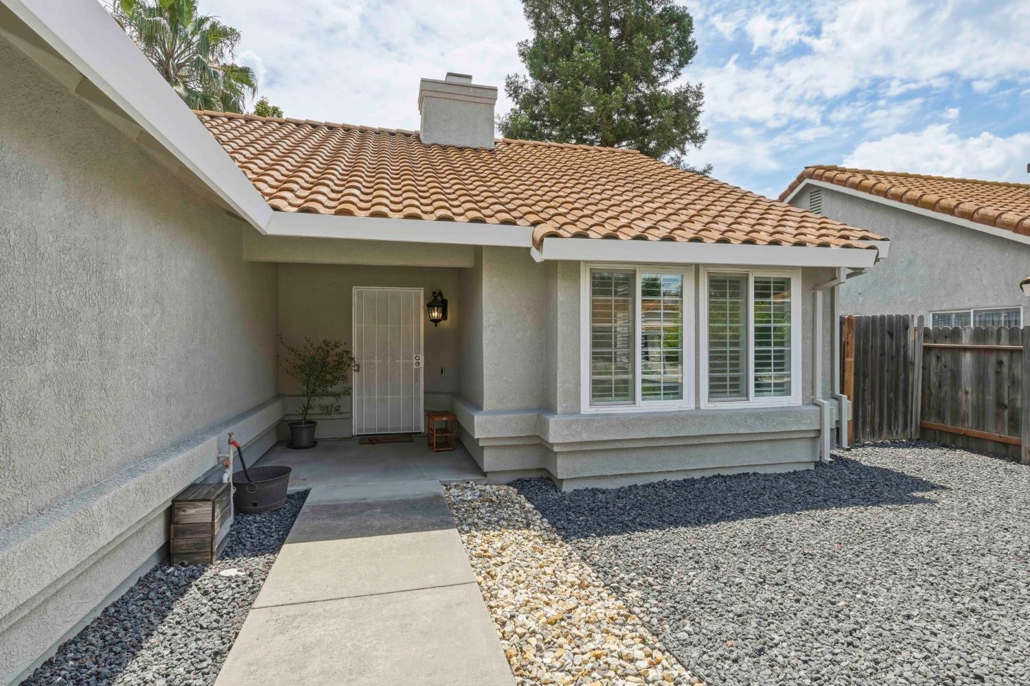 5013 Charter Road Rocklin, CA 95765 - Photo 3 of 35 a front view of a house with a large window