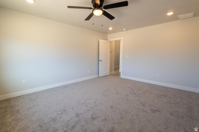910 East Remington Road Cedar City, UT 84721 - Photo 21 of 29 Spacious room featuring neutral carpeting, a ceiling fan with integrated lighting, and recessed ceiling lights