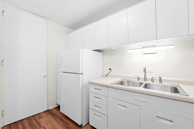 a kitchen with a sink and cabinets