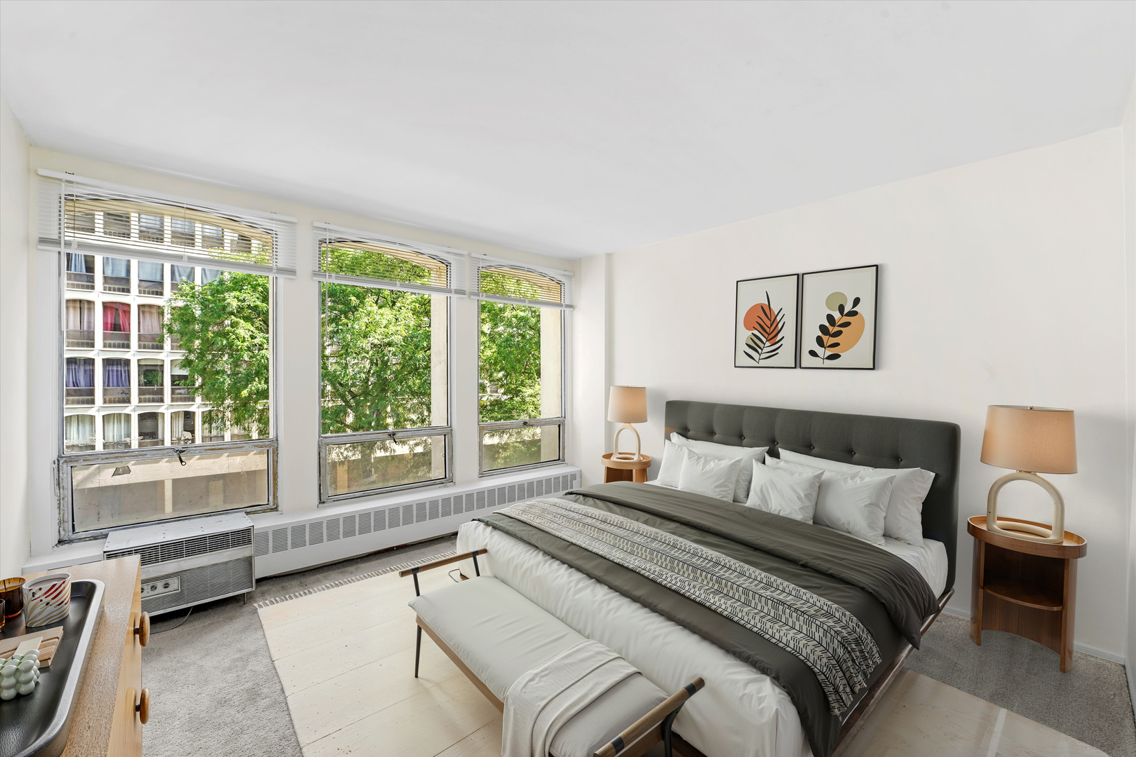 1450 East 55th Place, Unit 317S Chicago, IL 60637 - Photo 9 of 25 a bedroom with a bed and a large window