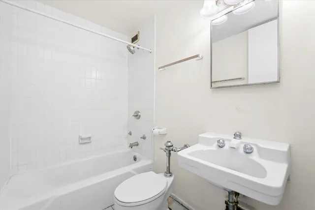 a bathroom with a sink toilet and bathtub