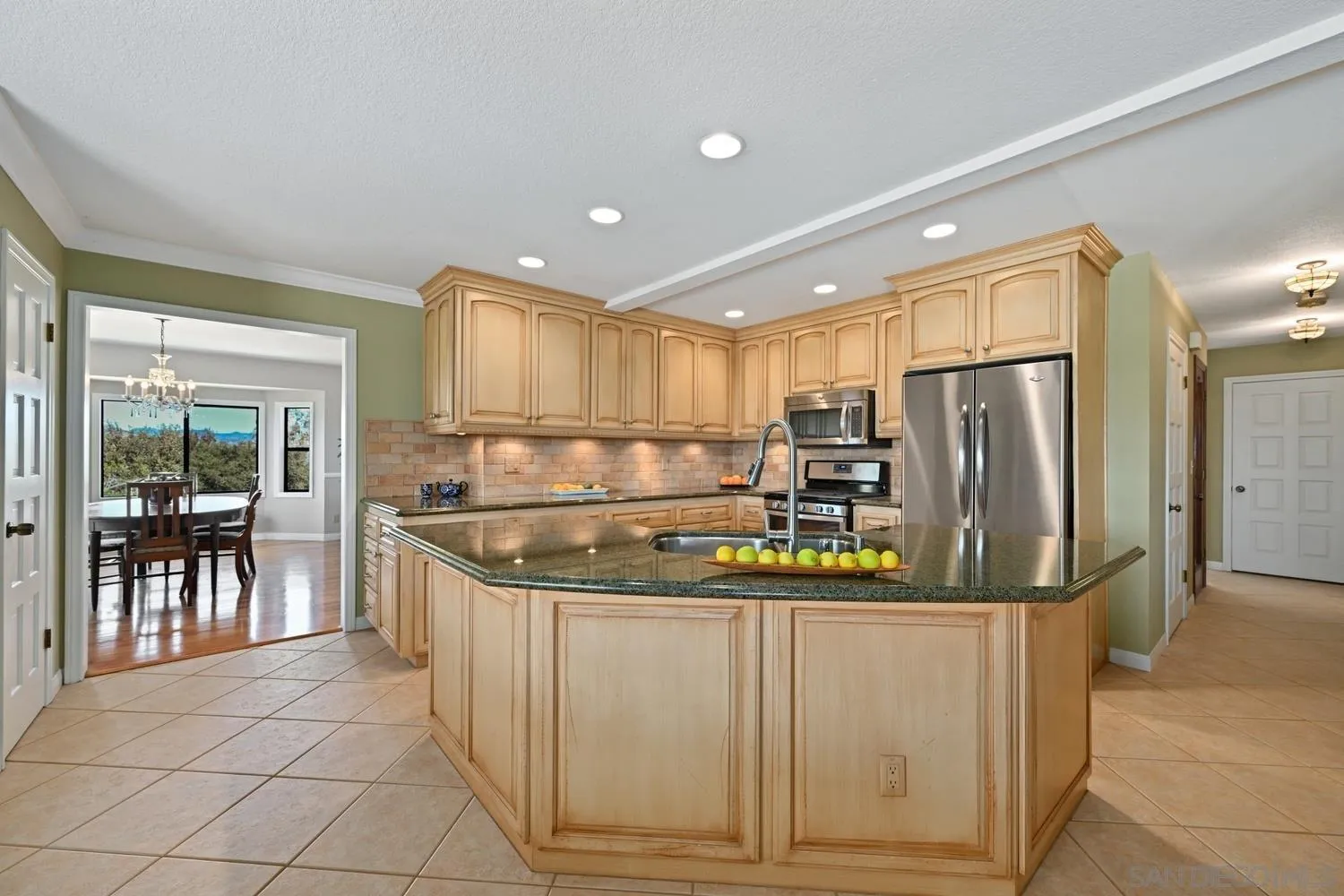1282 Olive Avenue Fallbrook, CA 92028 - Photo 14 of 55 a kitchen with stainless steel appliances granite countertop a refrigerator and a sink