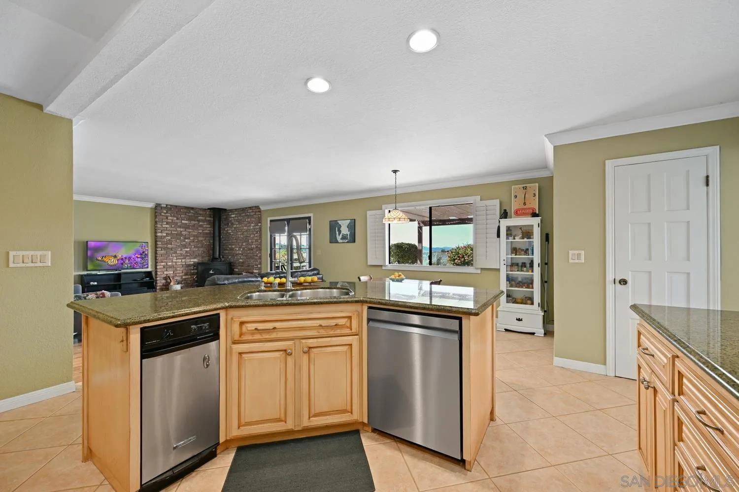 1282 Olive Avenue Fallbrook, CA 92028 - Photo 15 of 55 a kitchen with a sink and cabinets