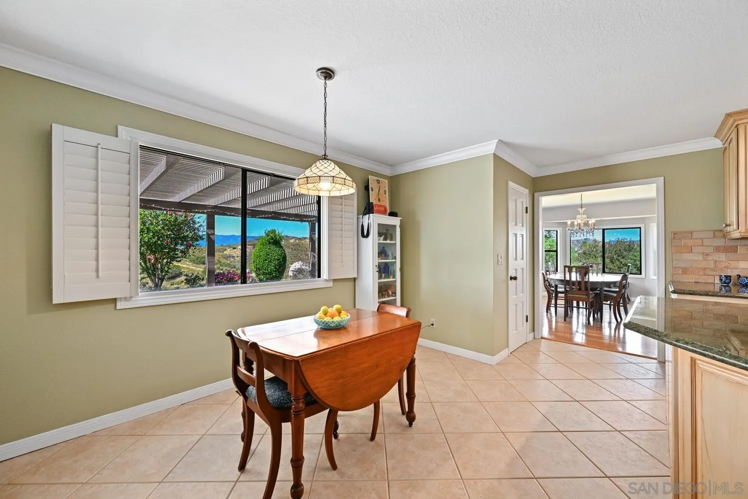 1282 Olive Avenue Fallbrook, CA 92028 - Photo 16 of 55 a view of a dining room with furniture window and outside view