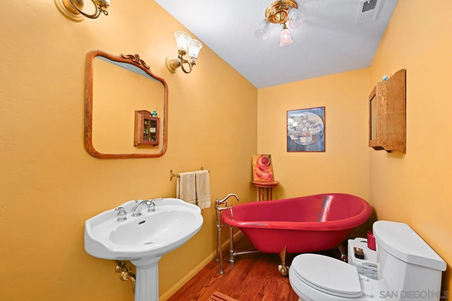 1282 Olive Avenue Fallbrook, CA 92028 - Photo 18 of 55 a bathroom with a toilet sink and mirror