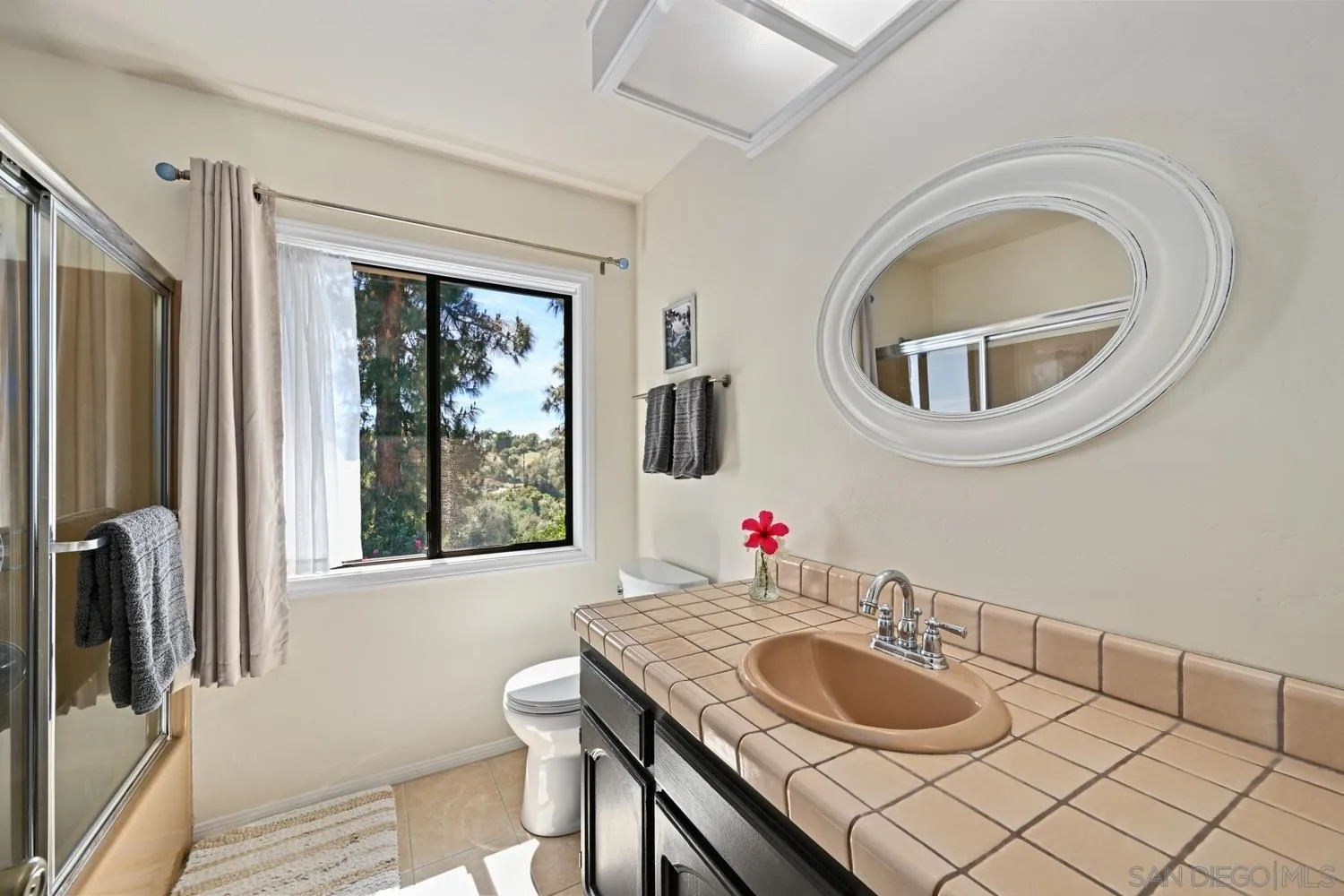 1282 Olive Avenue Fallbrook, CA 92028 - Photo 29 of 55 a bathroom with a granite countertop sink and a mirror