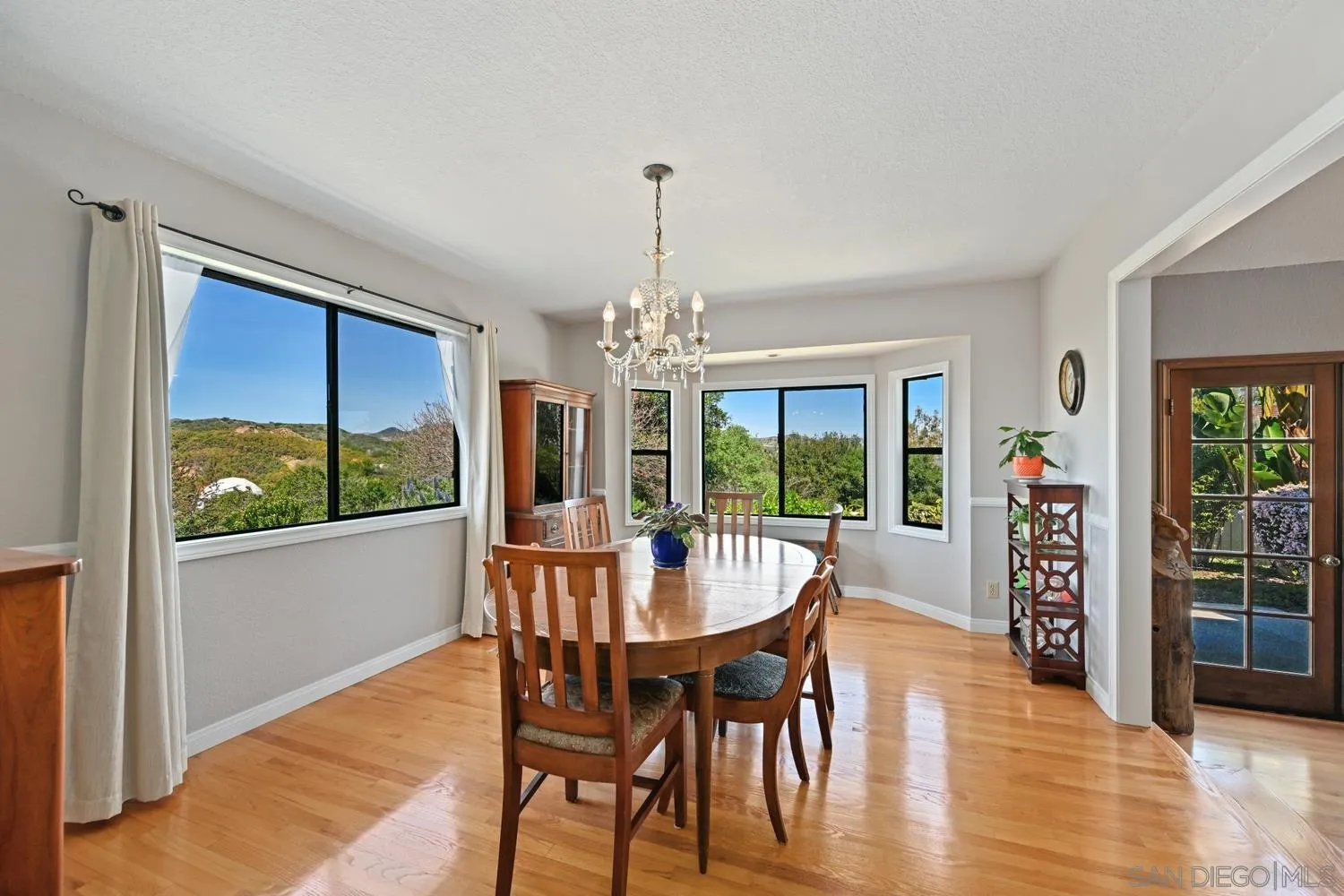 1282 Olive Avenue Fallbrook, CA 92028 - Photo 9 of 55 a view of a dining room with furniture window and wooden floor