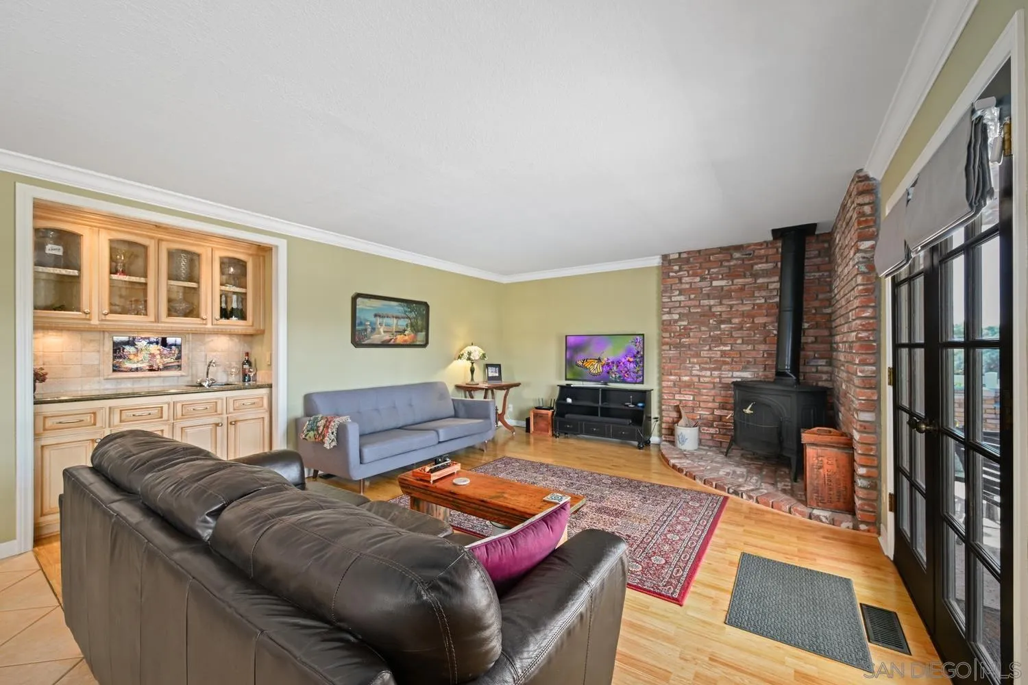 1282 Olive Avenue Fallbrook, CA 92028 - Photo 10 of 55 a living room with furniture a rug and a fireplace