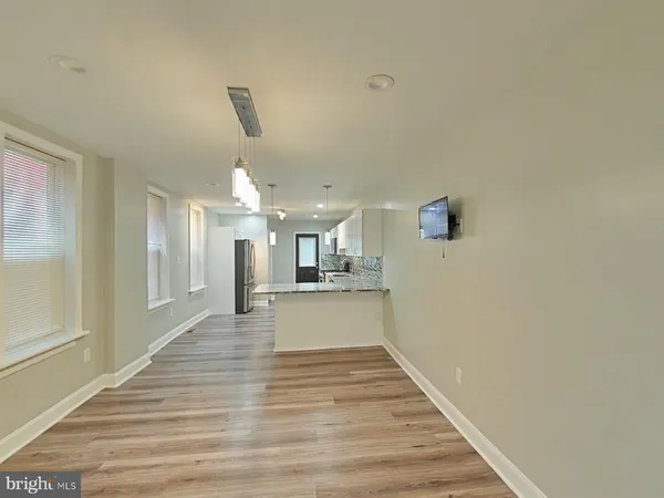 a view of a kitchen with a sink and cabinets