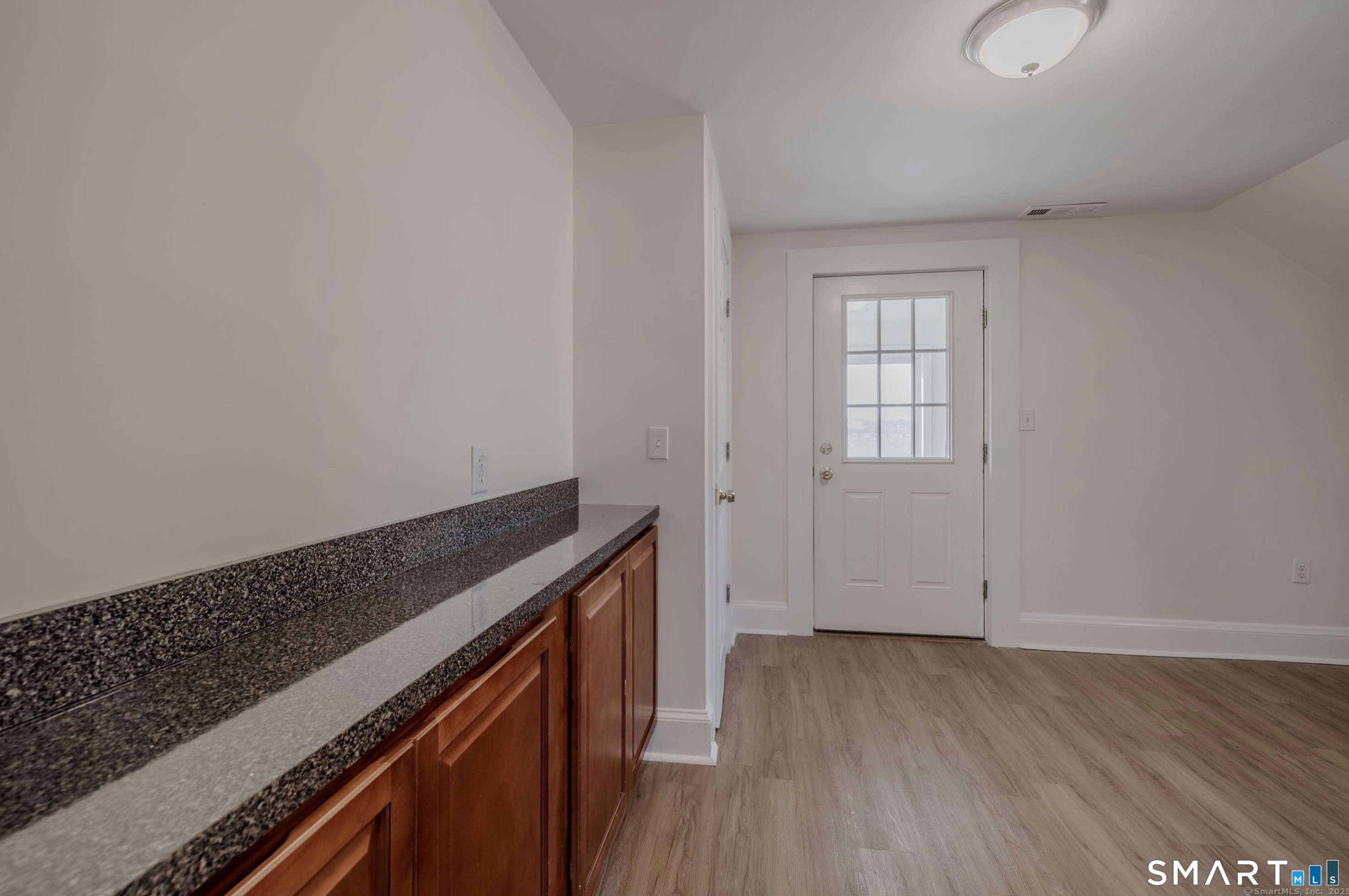 11 Piney Ridge Road Cromwell, CT 06416 - Photo 9 of 19 an empty room with wooden floor