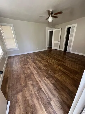 a view of an empty room with a window