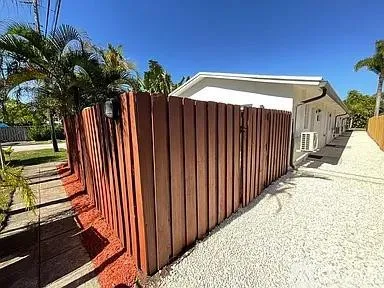 a view of a backyard with pathway