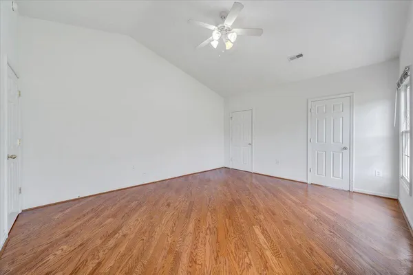 a view of a house with yard and a garden