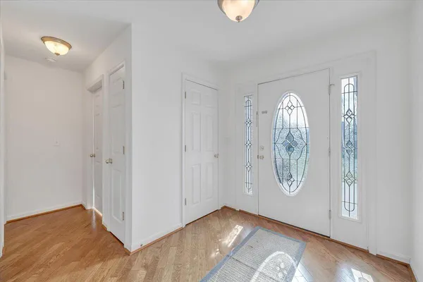 a living room with a fireplace and a floor to ceiling window