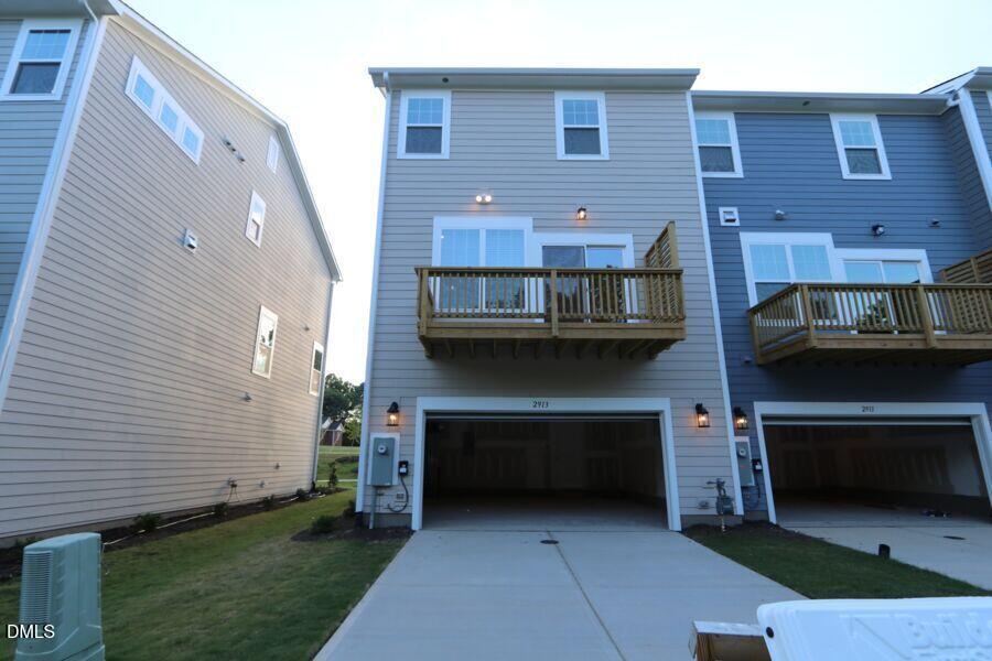 2913 Richardson Road, Unit 475 Apex, NC 27502 - Photo 18 of 24 a front view of a house with a balcony