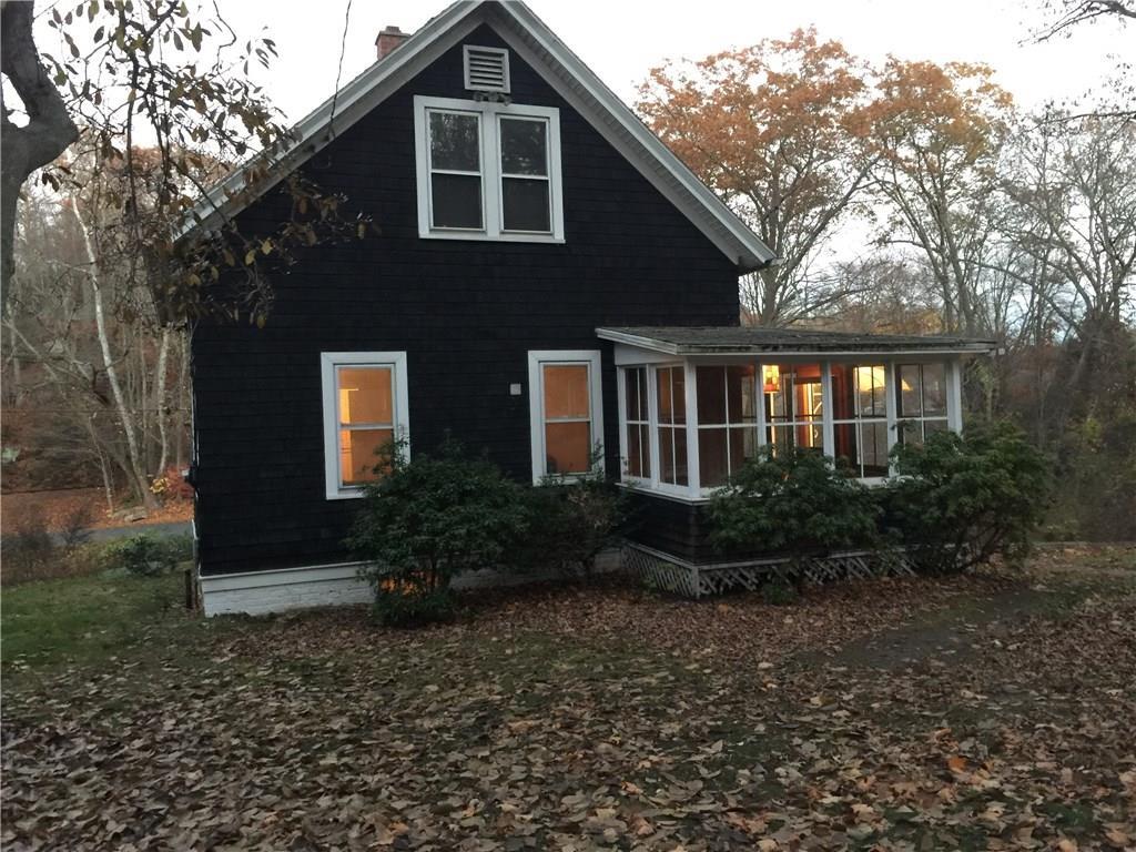 45 Deep River Road Essex, CT 06409 - Photo 1 of 1 a front view of a house with garden
