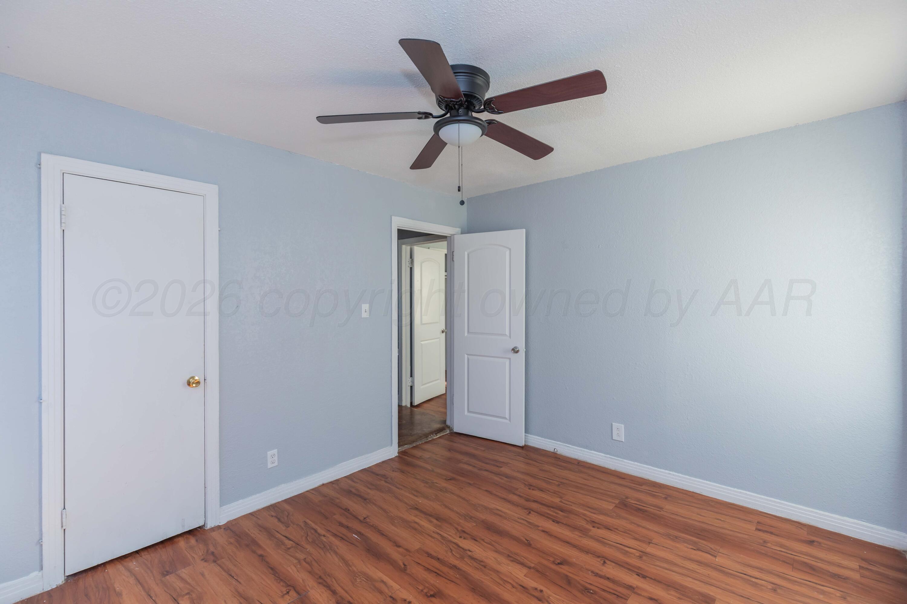 1811 North Wilson Street Amarillo, TX 79107 - Photo 16 of 27 a view of an empty room and wooden floor