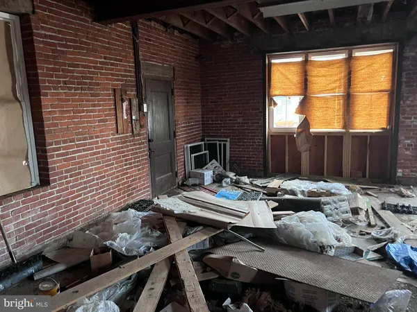 a view of a porch with wooden floor