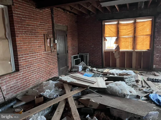 a view of a porch with wooden floor