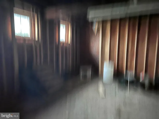 a room with water heater and a wooden floors