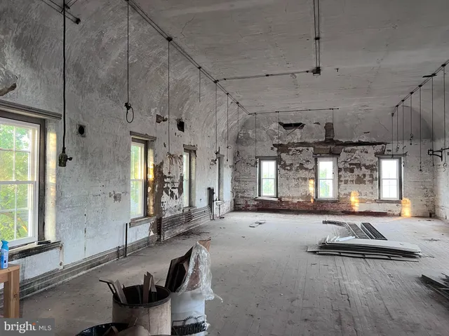 a view of a entryway with stairs and wooden floor
