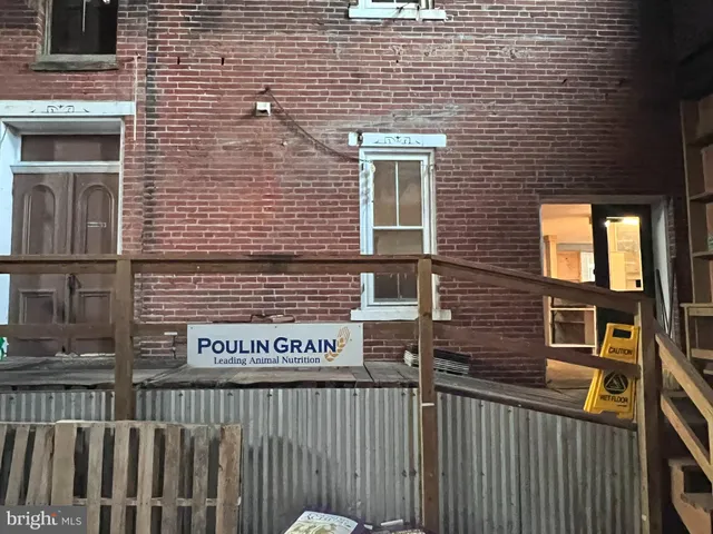 a view of a brick building with many windows