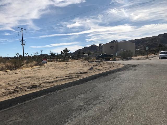 7282 Olympic Road Joshua Tree, CA 92252 - Photo 3 of 4 a view of a road with an ocean beach