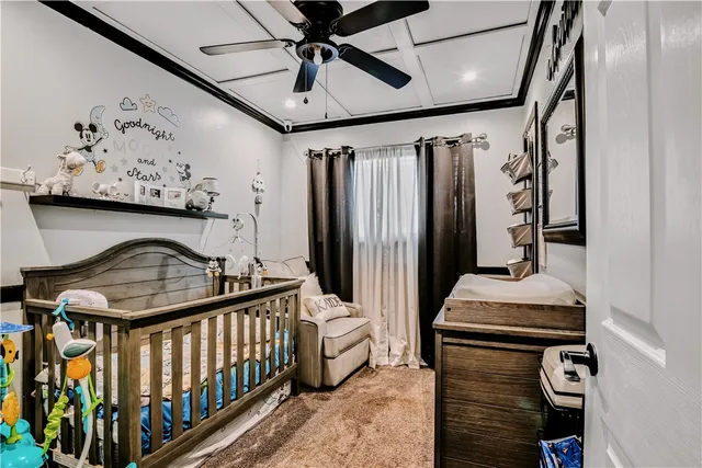 a bedroom with furniture and a window