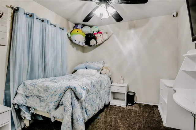 a bedroom with bed and a window